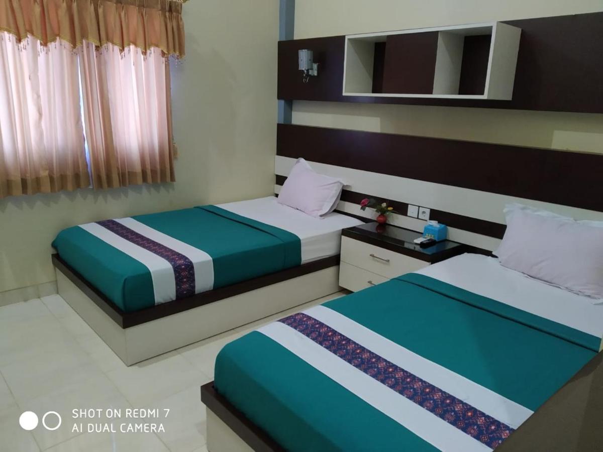 Hotel Pilar Mosa Muarawahau Bagian luar foto