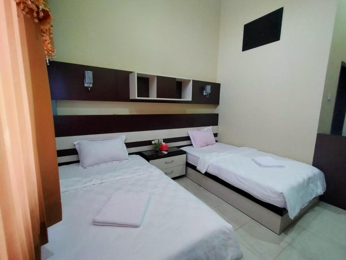 Hotel Pilar Mosa Muarawahau Bagian luar foto